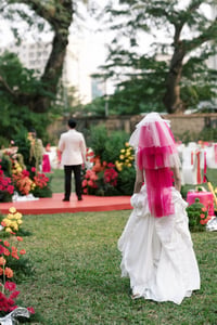The bride is walking toward her groom