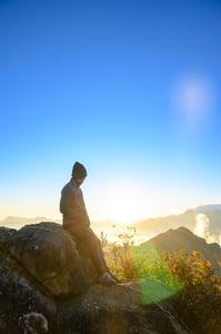 A man watching sunrise