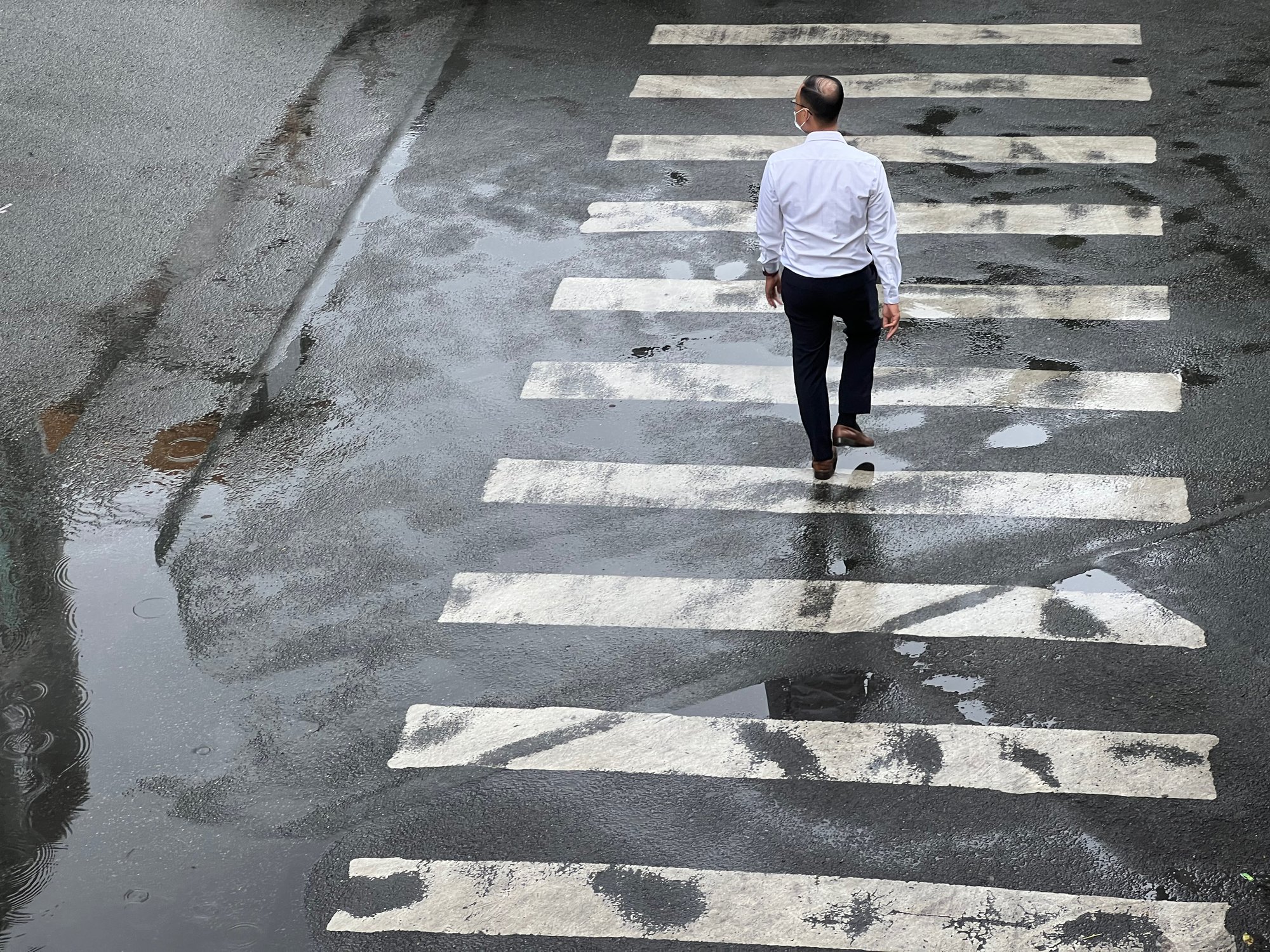 A man crossing the street