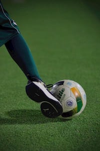 A kid shooting the ball