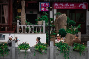 Two elderly couples taking photos at a tourism location