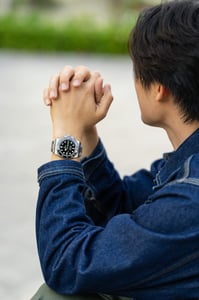 A man with his newly earned Rolex watch