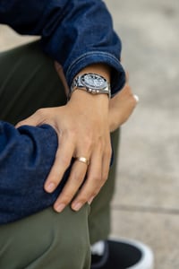 A man with his Rolex luxury watch