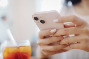 Hands holding smartphone