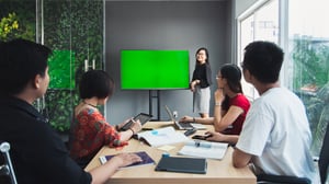 A young girl presenting in a meeting