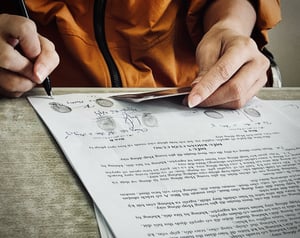 A notary working on a document