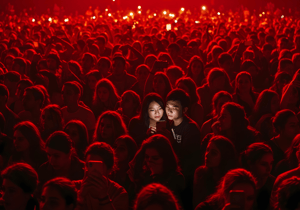 A couple looking at smartphone during an event