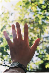 A hand hiding the light
