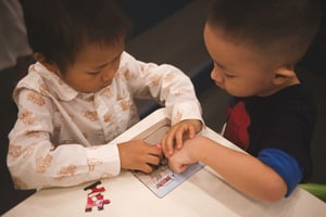 Kids playing puzzle together