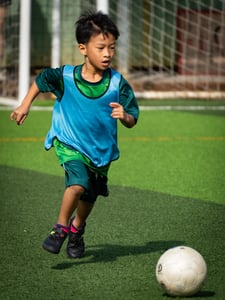 Boy dribbling the ball
