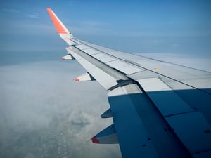 Wing of an airplane in the sky