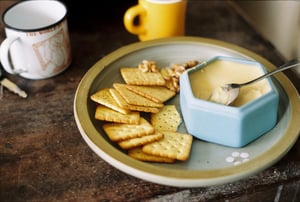 Cozy morning snack setup with biscuits and walnuts on a rustic wooden table
