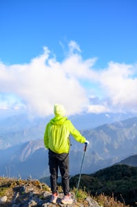 A hiker standing on the mountain