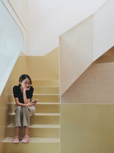 A girl looking at a smartphone