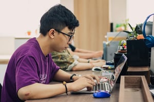 A young boy working on a laptop