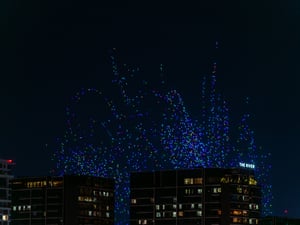 Drones flying up for a show