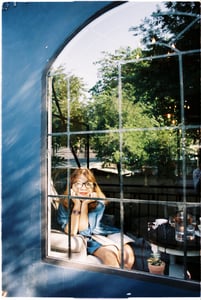 Girl looking through the window