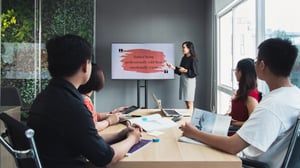 A young girl presenting in a workshop