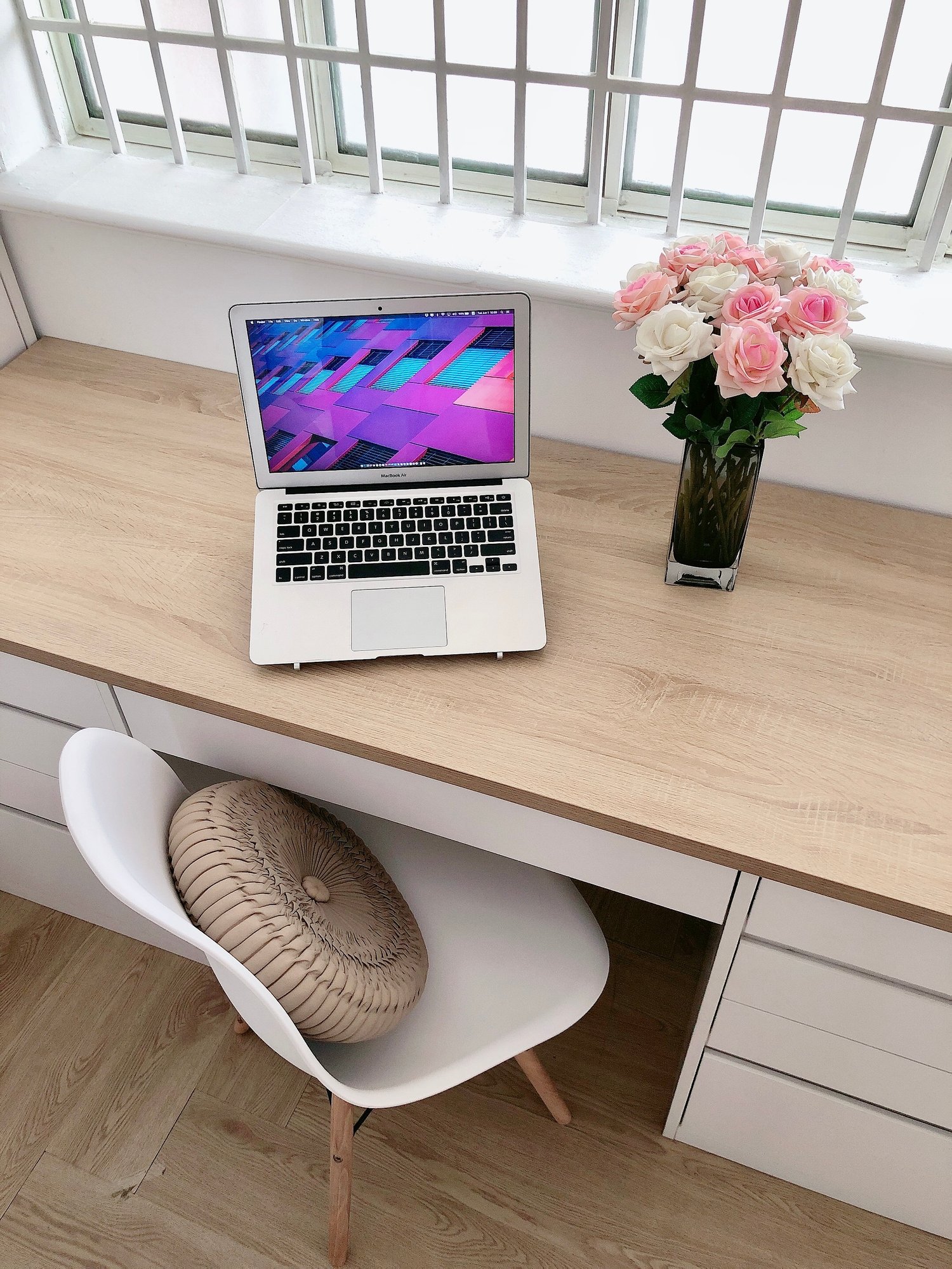 A Macbook Air on a desk (top-down)