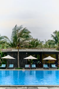 A tropical resort swimming pool and bar setup
