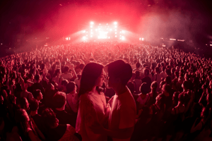 Wide Angle of a couple hand-in-hand during an event