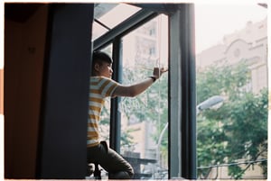 Artist painting on glass