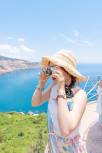 Girl taking a film photo