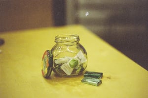 Small glass jar filled with apple candies