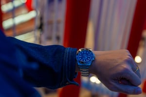 Man showing off his Rolex Watch