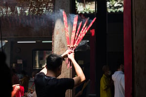 Man burns incense