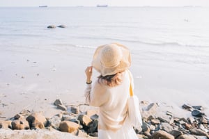 Back View Of Woman Looking To Sea
