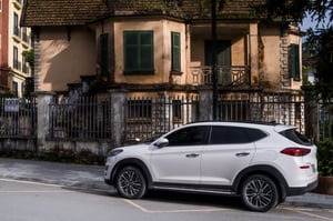 White car and a vintage house
