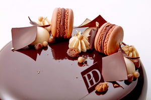 Macaron on a chocolate cake