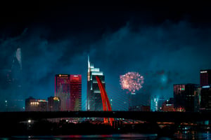 Crowd watching fireworks on Ba Son bridge