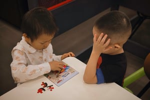 Kids playing puzzle together
