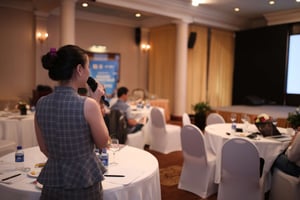 Woman speaking at a seminar