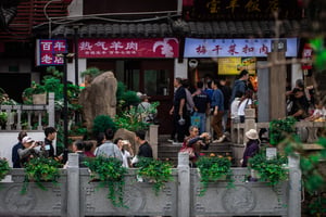 3 couples taking photos at a tourist location