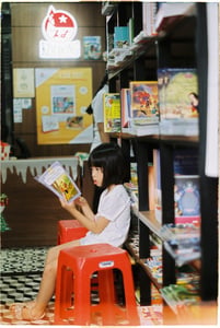 Little girl reading a book