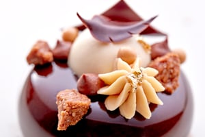 Macaron on a chocolate cake