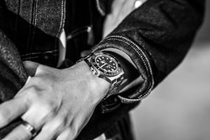A fashionable man with his luxury Rolex watch