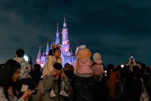 Kids enjoying a theme park castle