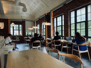 People working in a modern coffee shop