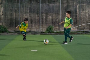 Kids playing football