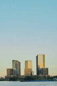 Reflective office and residential buildings over the horizon