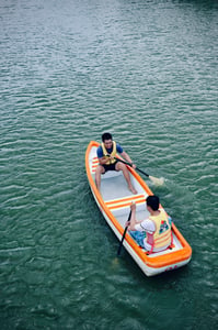 Boy rowing boat