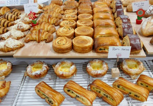 Fresh baked pastries close-up on a bakery showcase