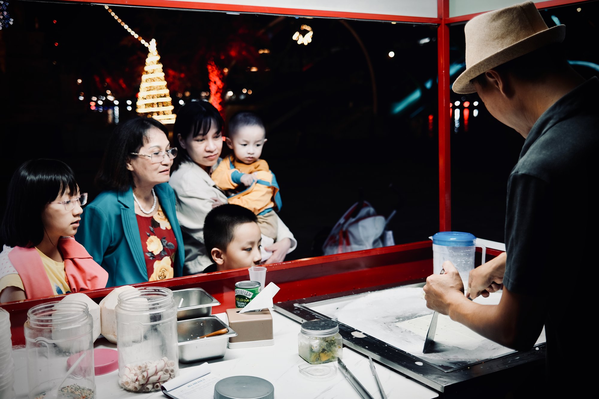 Family Watching Thai Icecream in the making