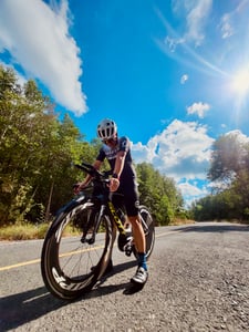 Man standing with bicycle