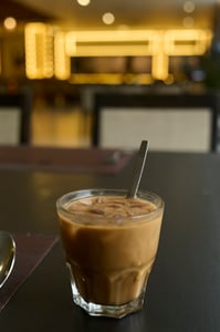 Having a glass of Vietnamese condensed milk coffee at a fancy resort