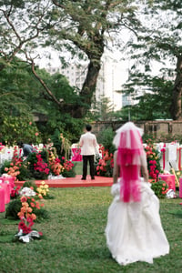 The bride is walking toward her groom